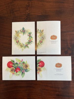 Voor- en achterkant van twee kerstkaarten